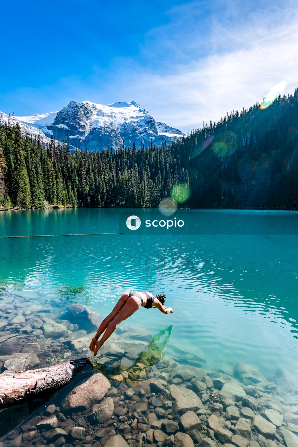 Woman in bikini jumping into water