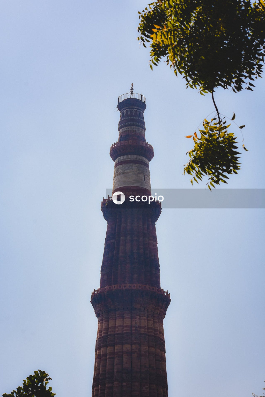 Brown and white tower under white sky