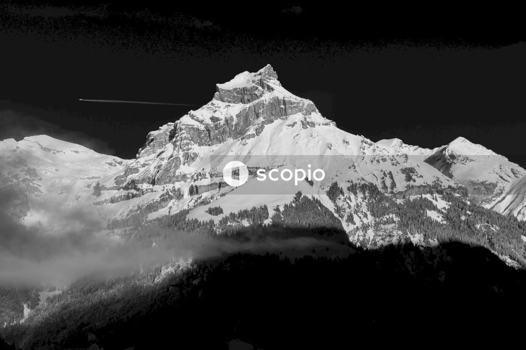 Majestic Snow Capped Peak Towers Over Landscape