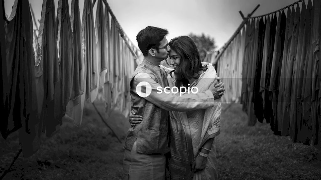 Grayscale photo of couple hugging