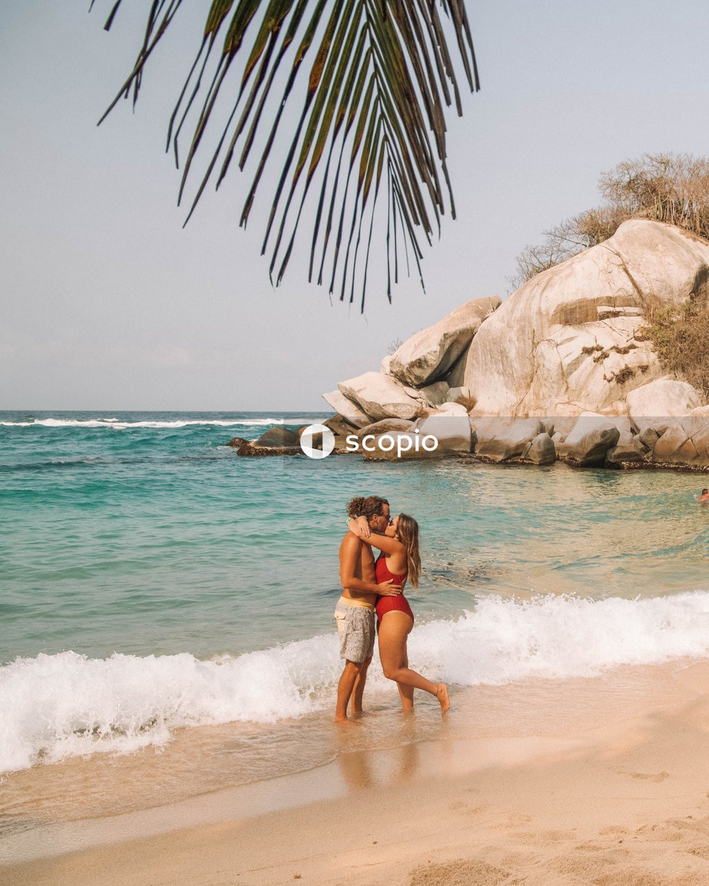 Couple kissing on tropical beach