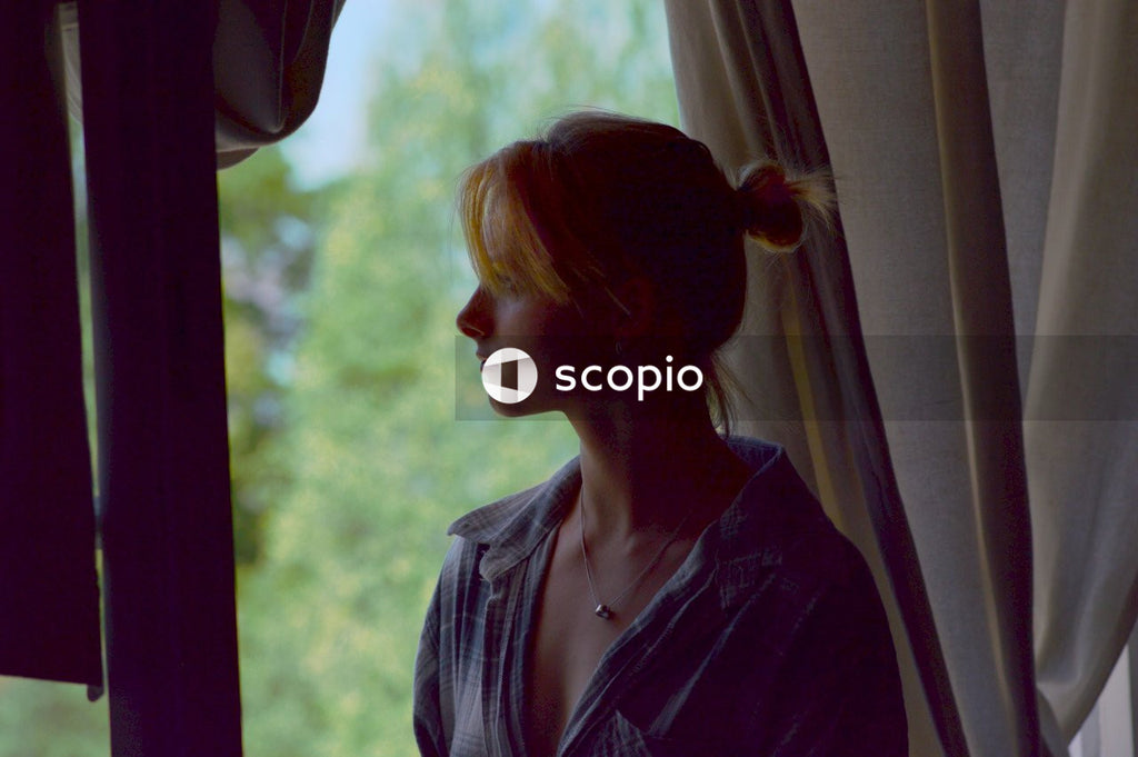 Woman looking outside the window