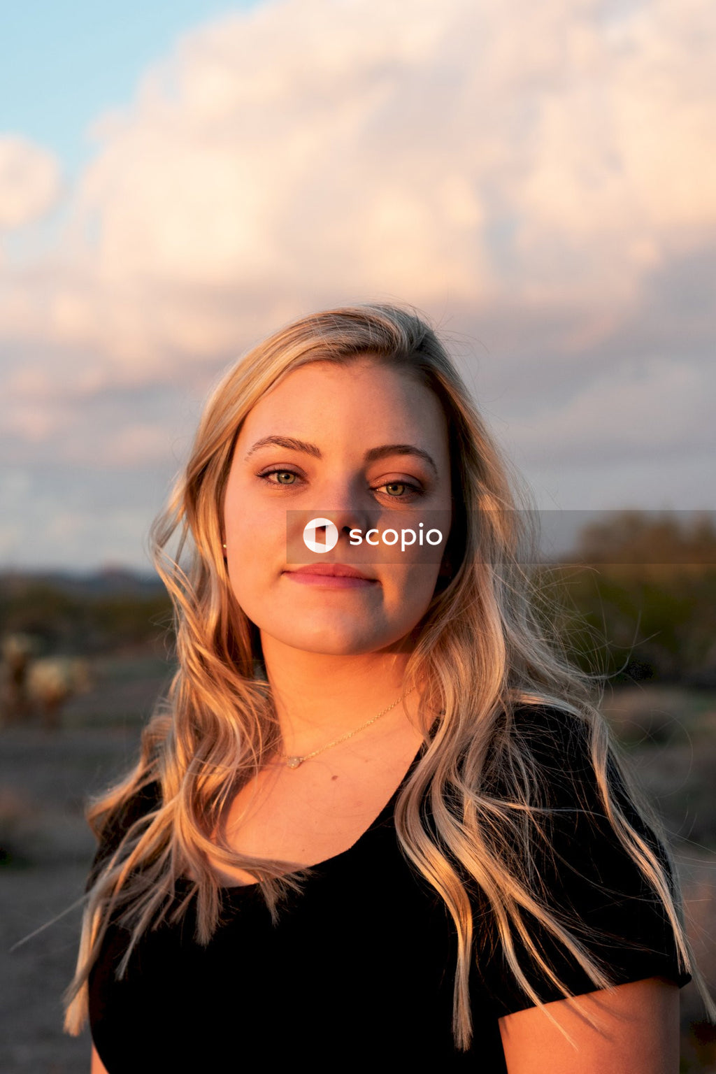 Portrait of woman in dark shirt outdoor
