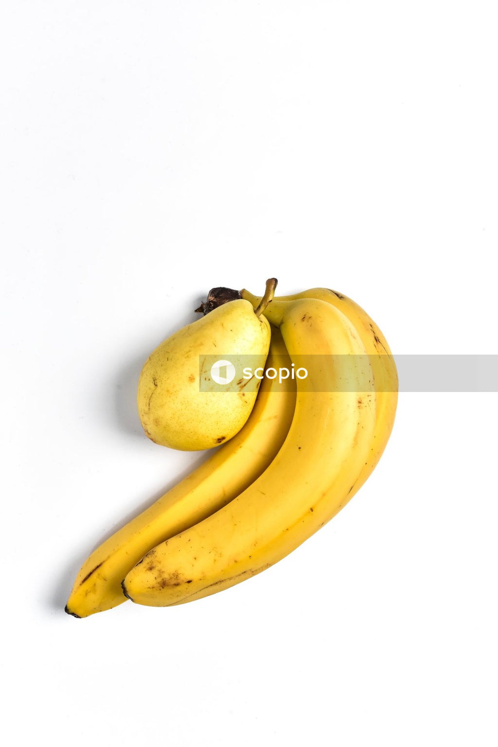 Three Yellow bananas and pear