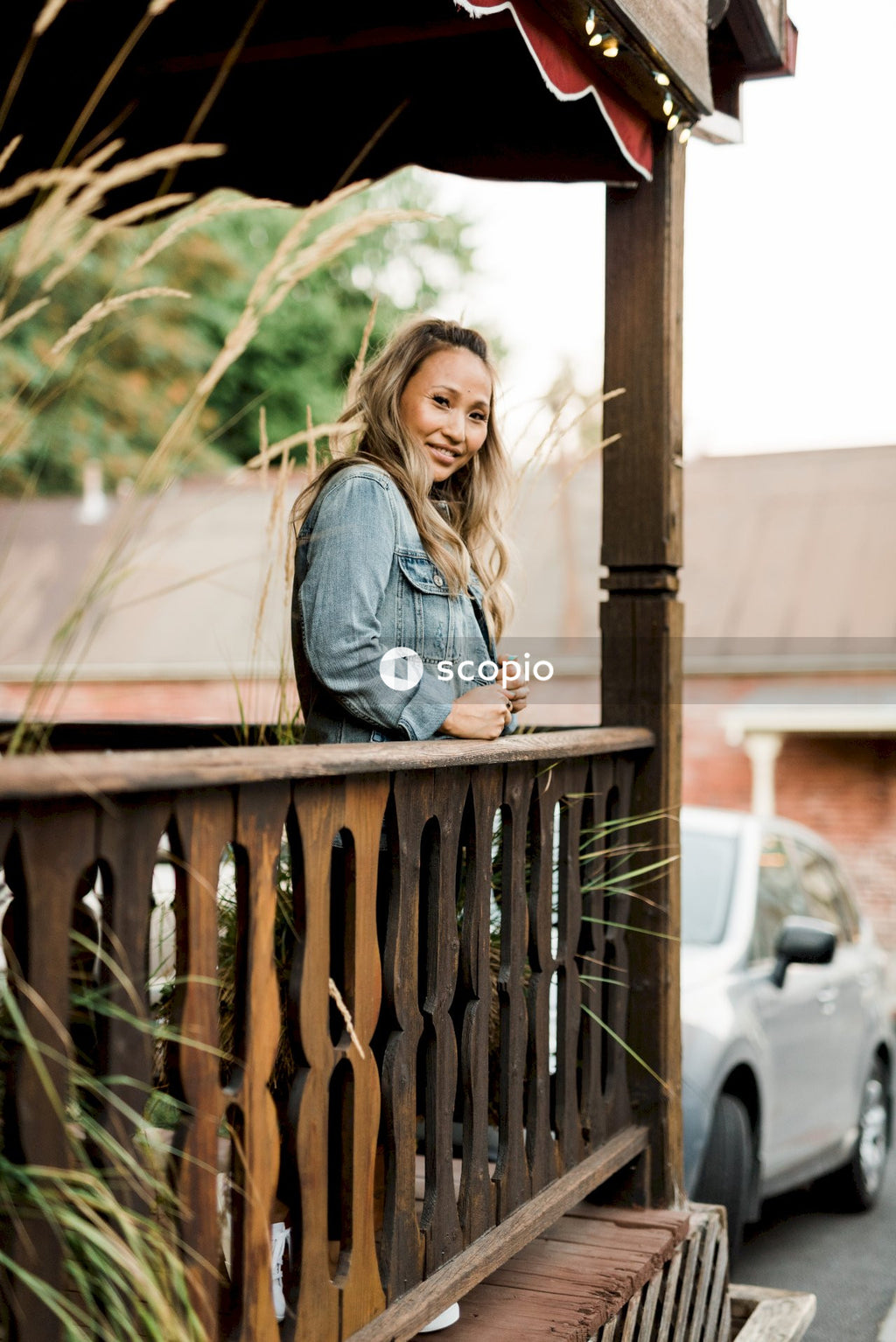 Woman standing at the balcony