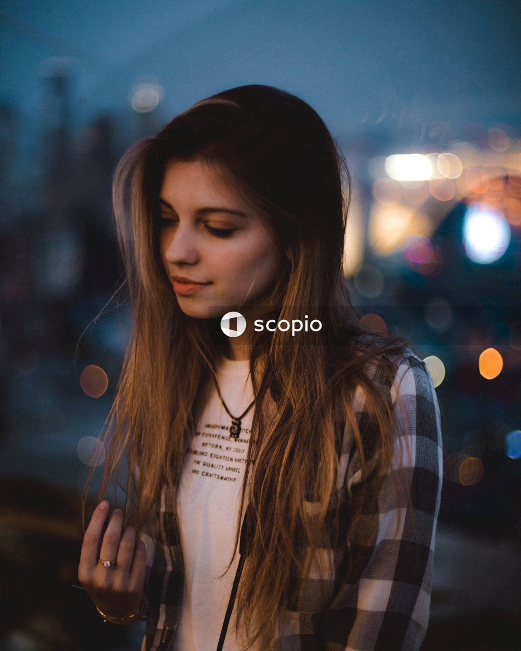 Portrait of young woman outdoor at night