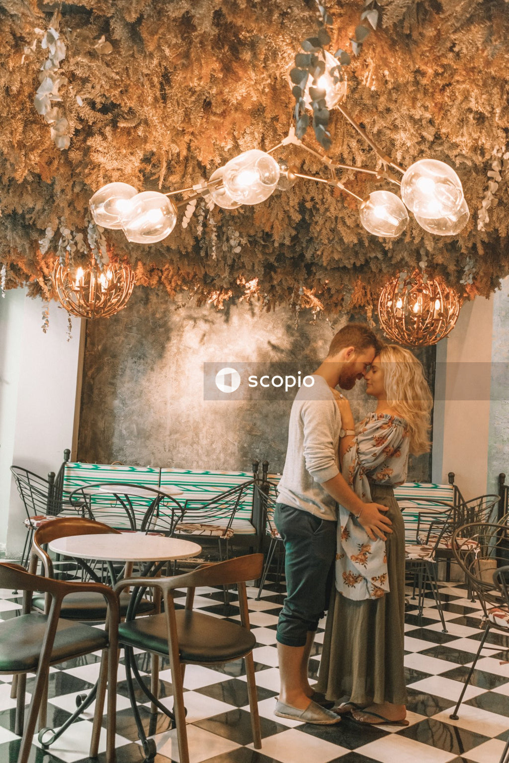 Man and woman hugging each other in a restaurant