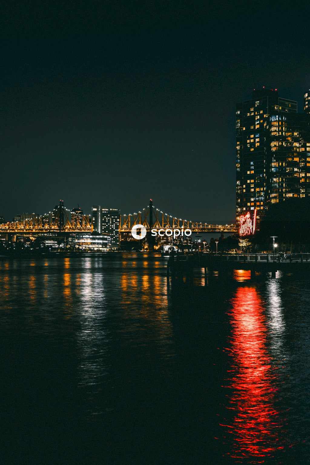 City Skyline With Bridge and Buildings Lit up at Night