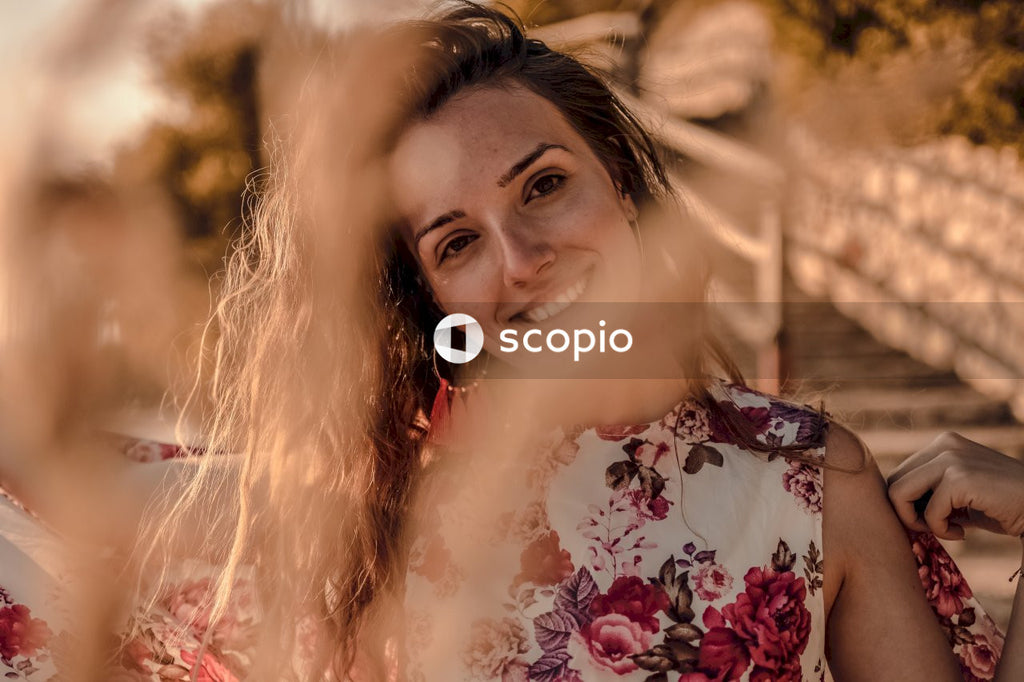 Caucasian Woman in red floral shirt smiling