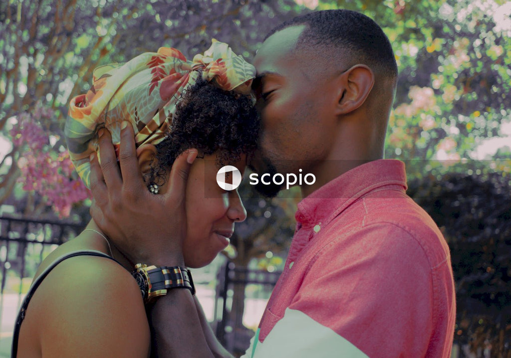 Side view of man kissing woman's forehead