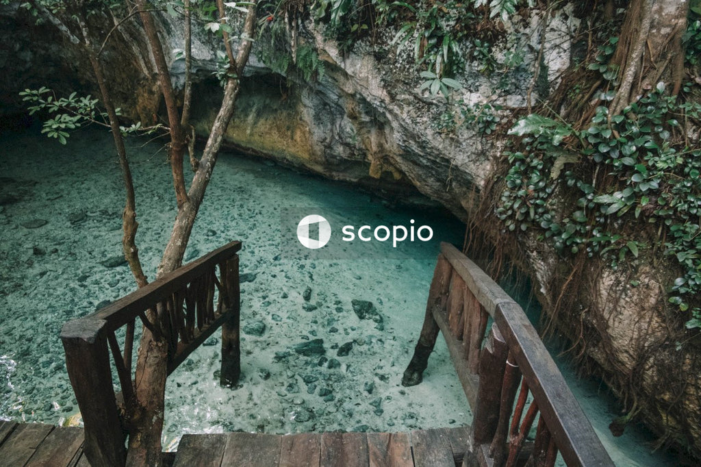 Brown wooden bridge over river