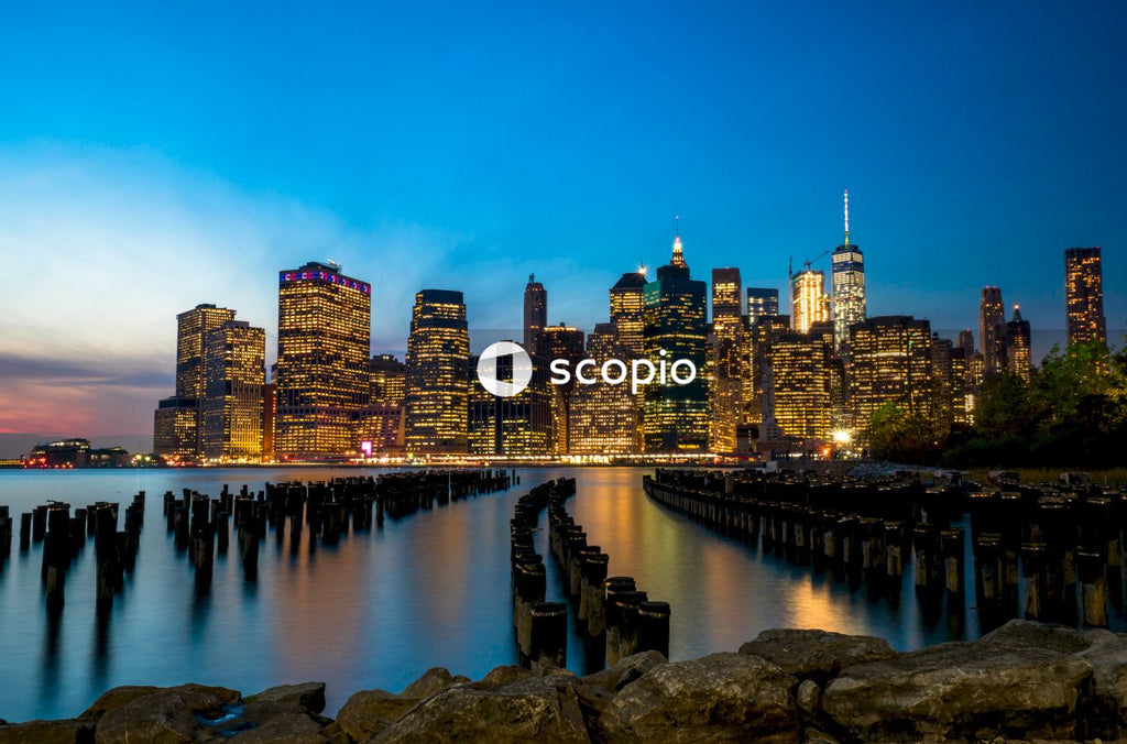 City skyline across body of water during nighttime