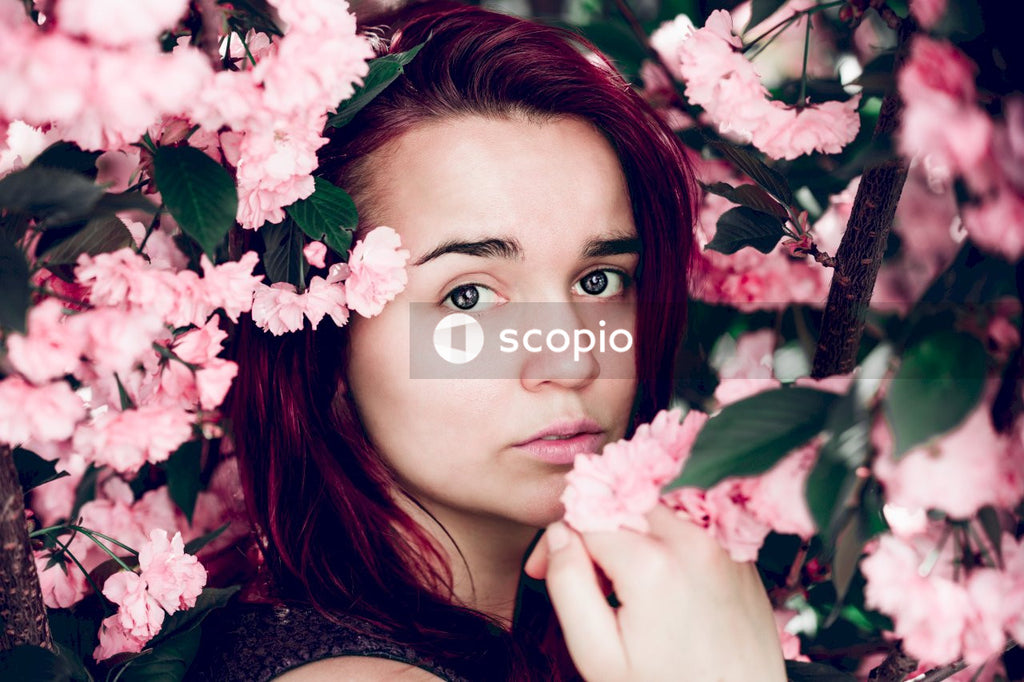Pink flowers frame face