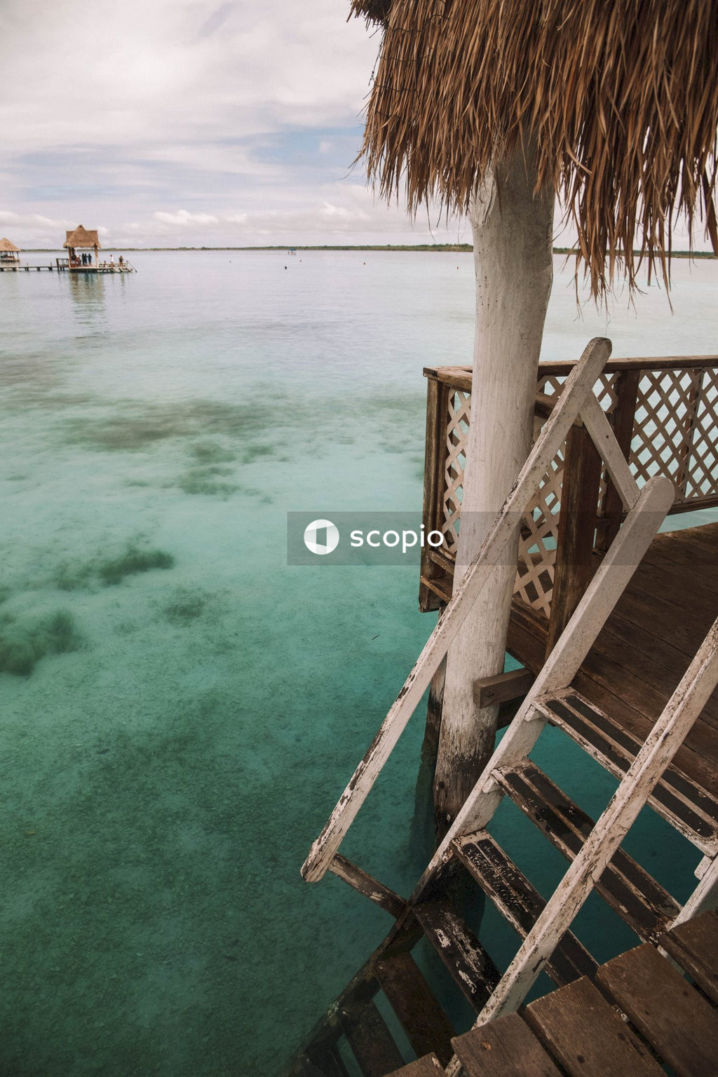 Brown wooden stairs on blue sea