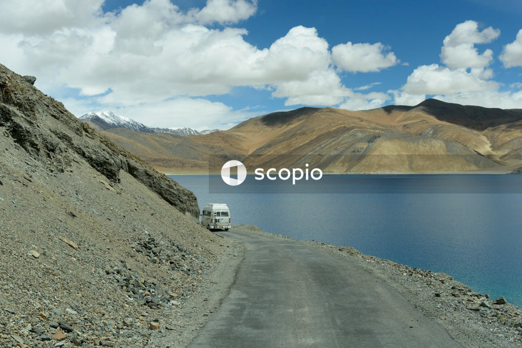 White van on road near lake