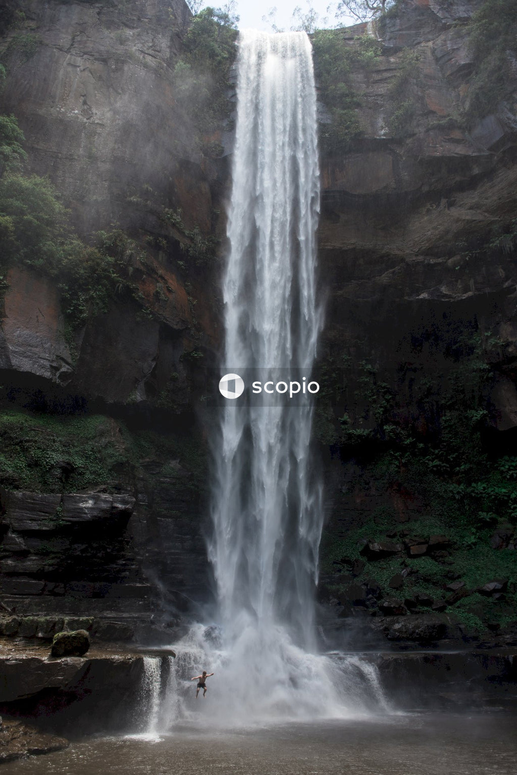 Waterfalls on brown rocky mountain