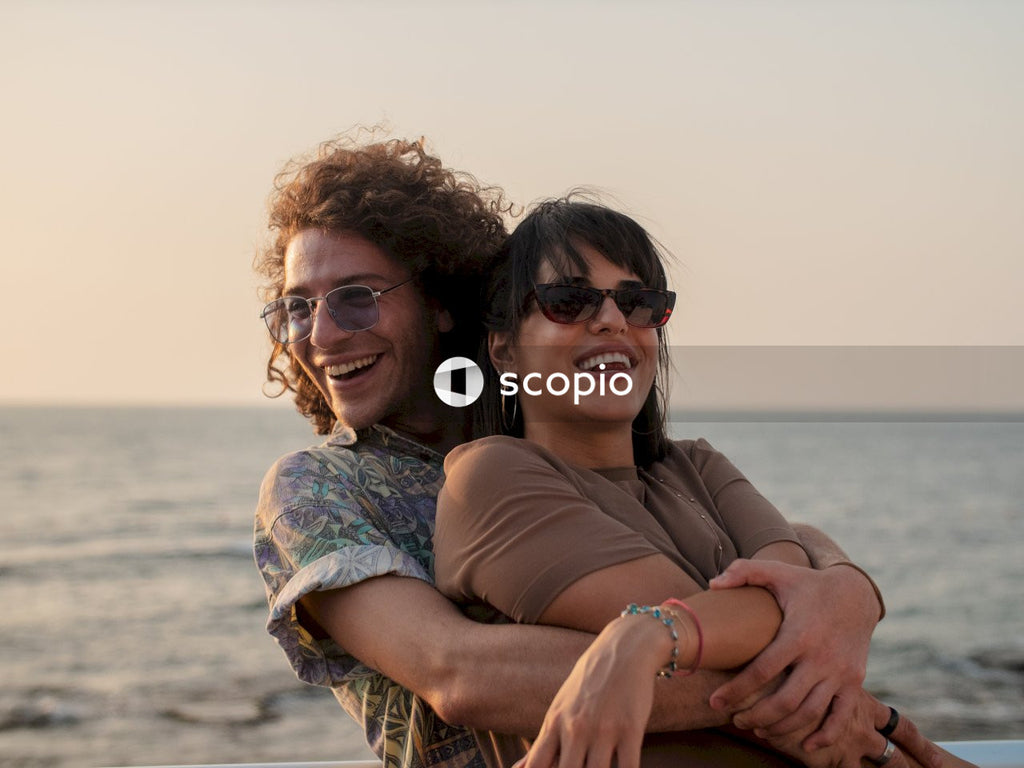 Man holding woman by the sea