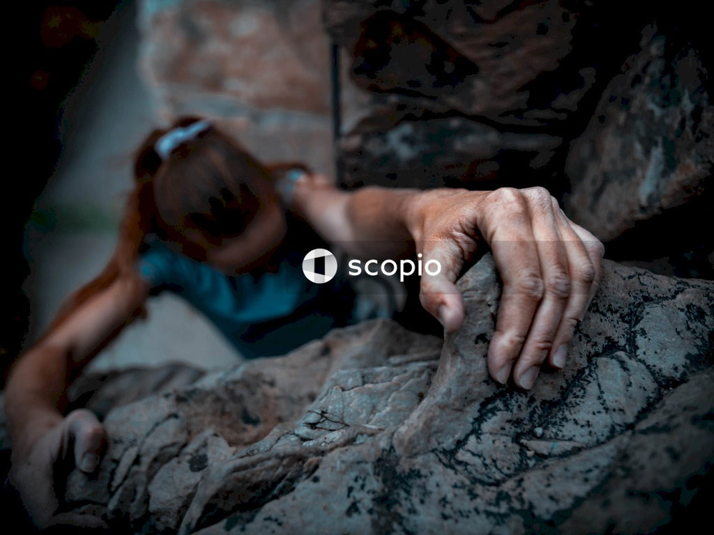 Moment of Strength and Courage as Rock Climber’s Hand Grips Rock