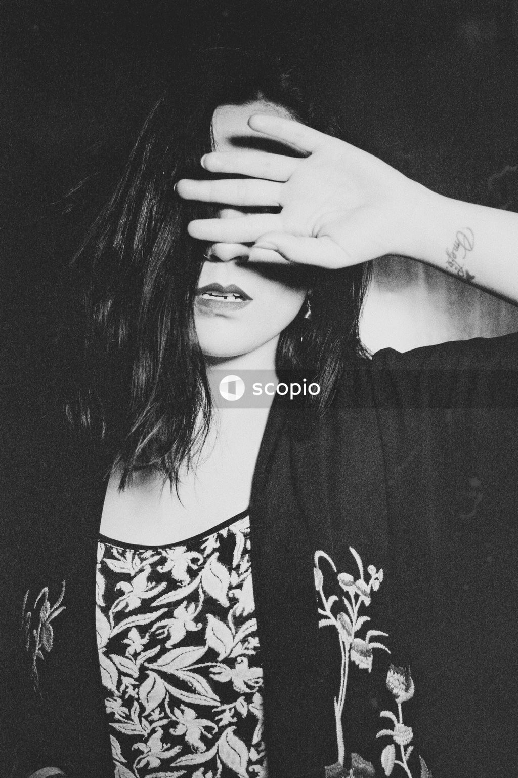 Her fingers across eyes