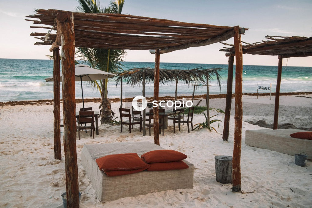 Brown wooden frame over bed on sea shore