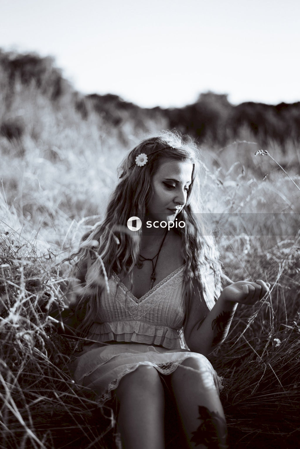 Grayscale photo of woman in dress
