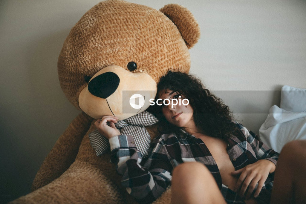 Woman hugging teddy bear