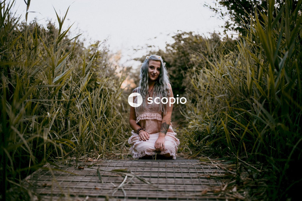 Blonde amidst grass