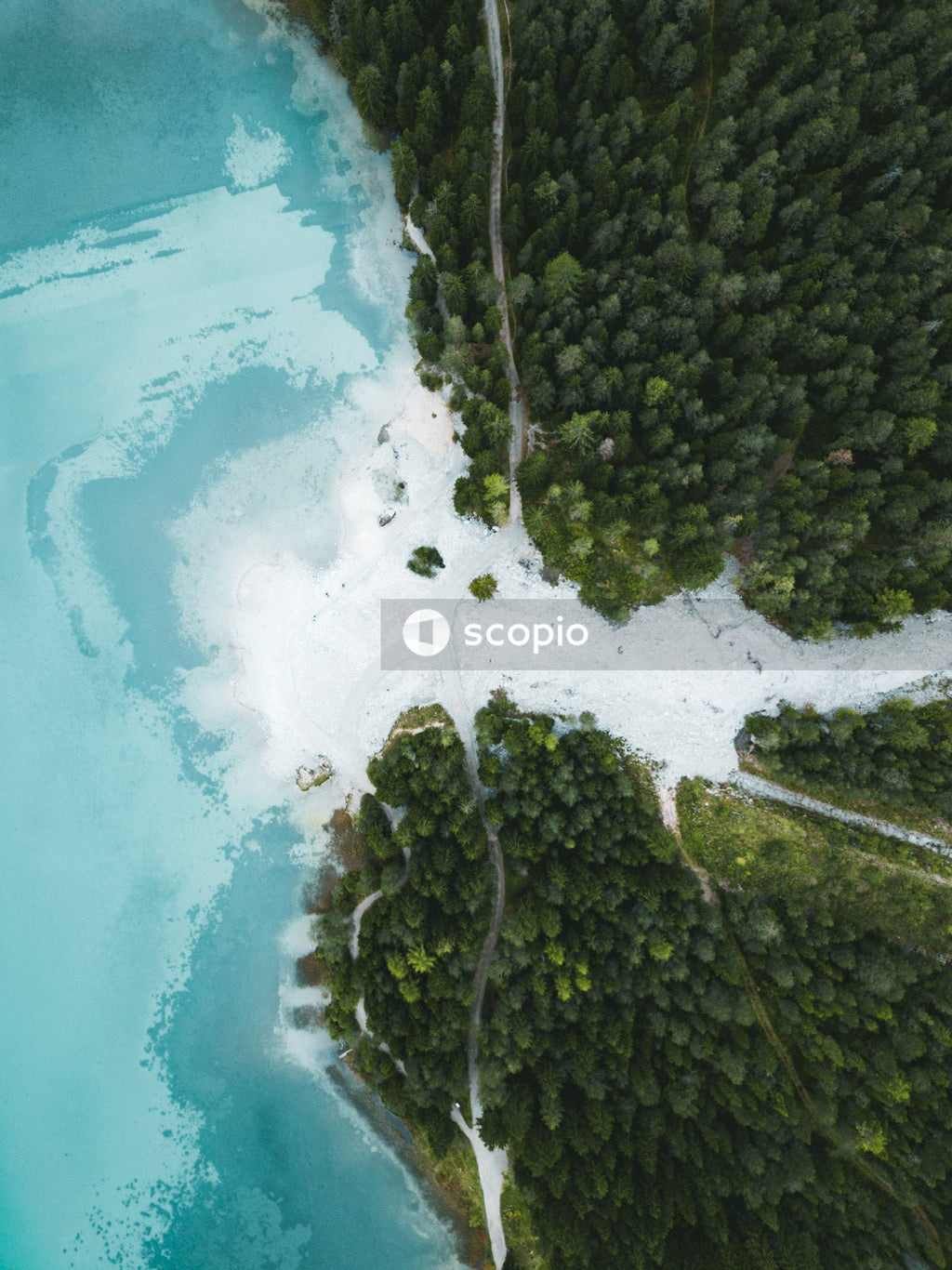 Aerial view of river falling into sea