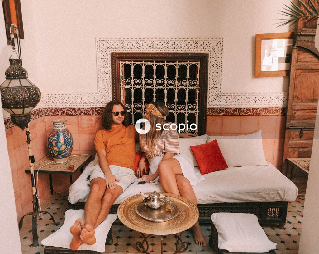 Man and woman sitting on couch