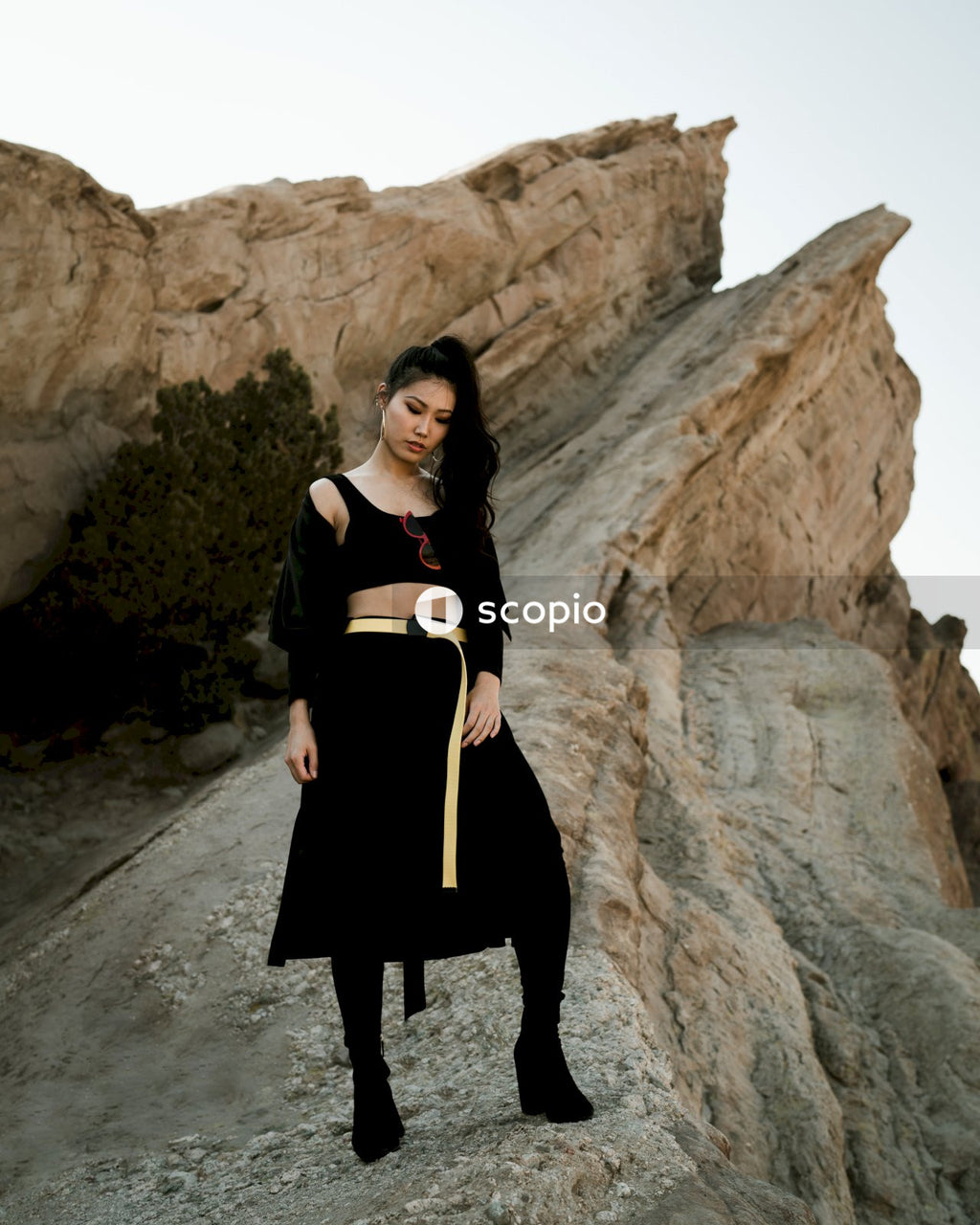 Woman standing on boulder