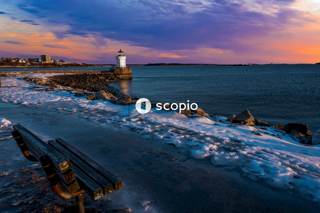 Brown wooden bench on seashore