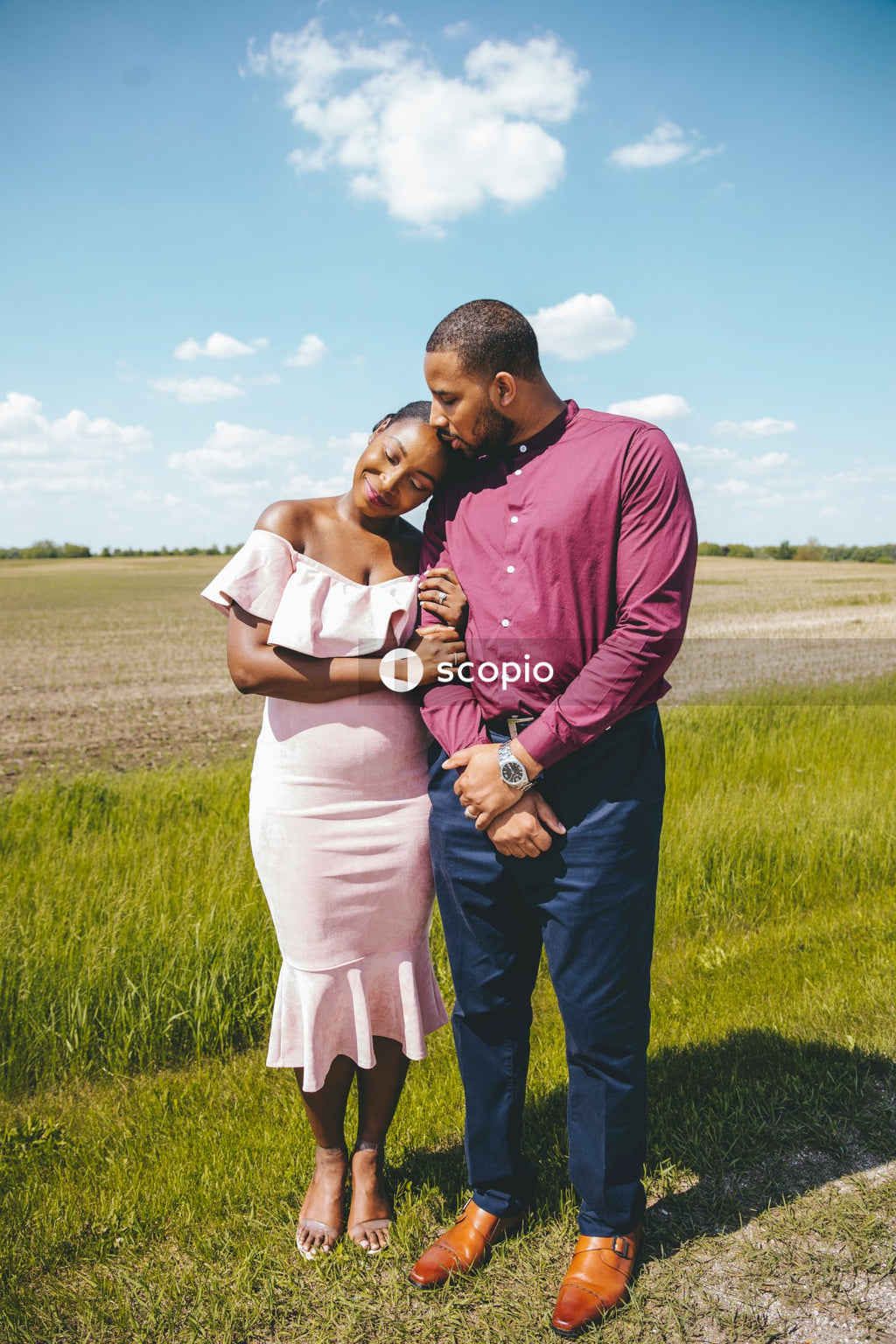 Couple standing on green grass