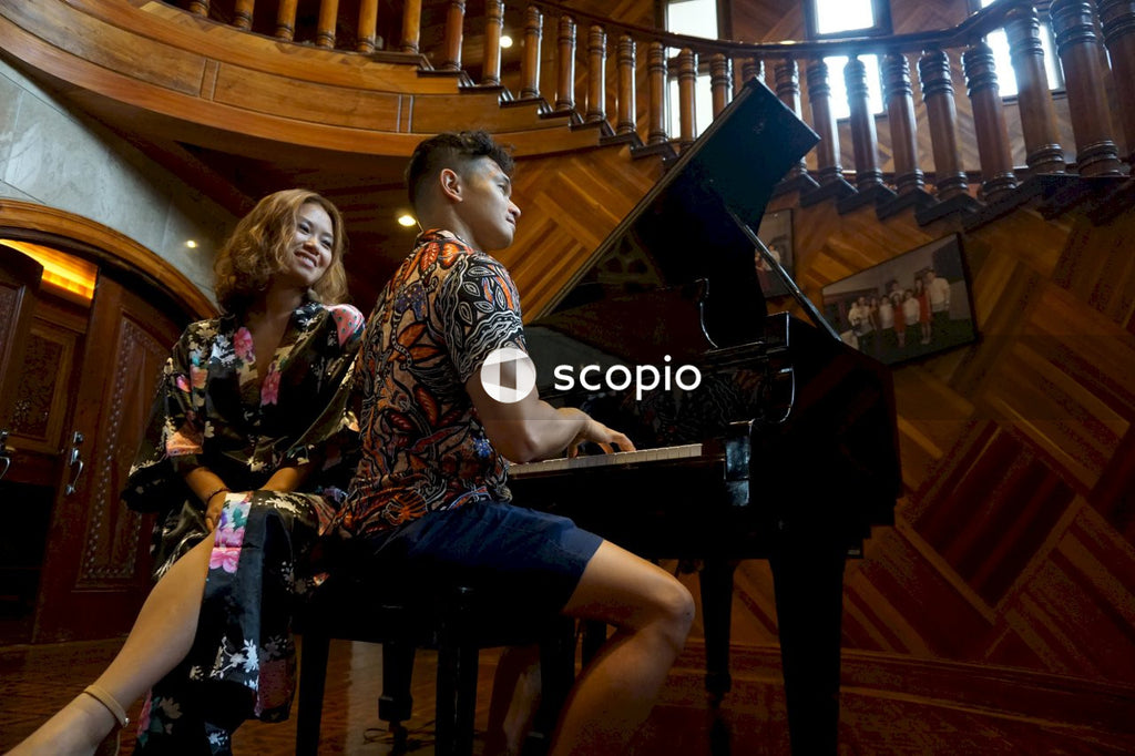 Man playing piano for his date