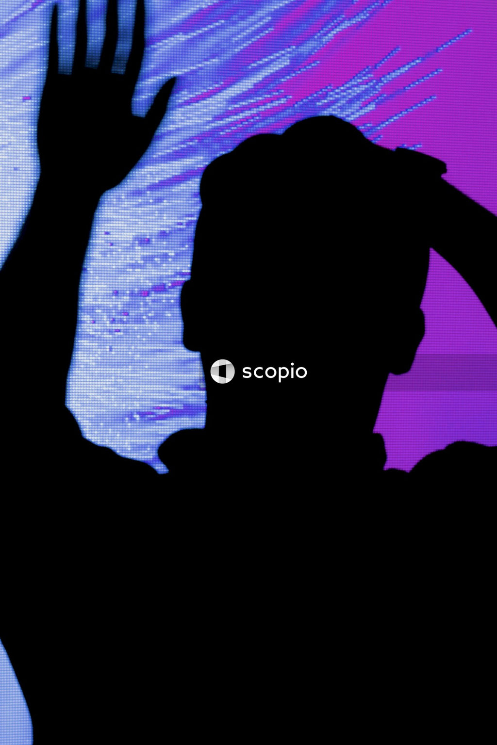 Silhouette of person standing on rock formation