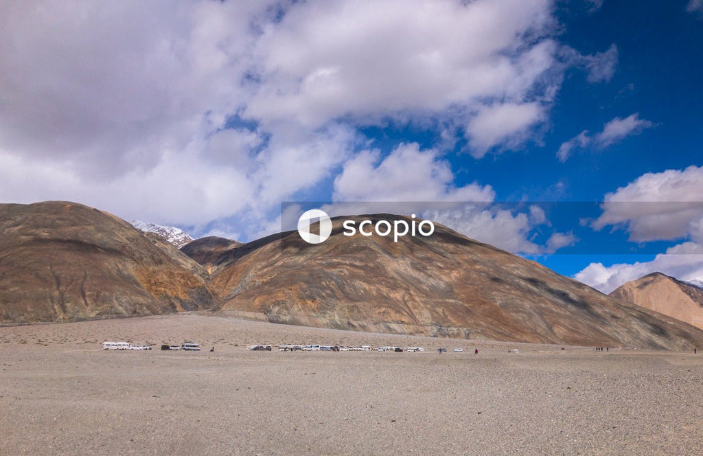 Brown mountain under blue sky
