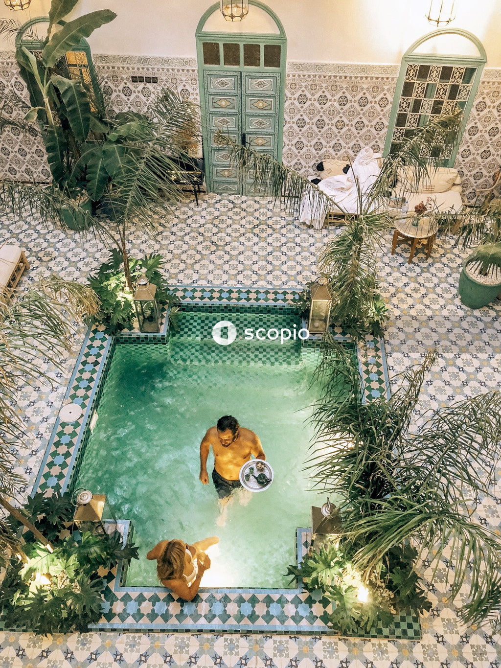 Top view of man and woman in swimming pool