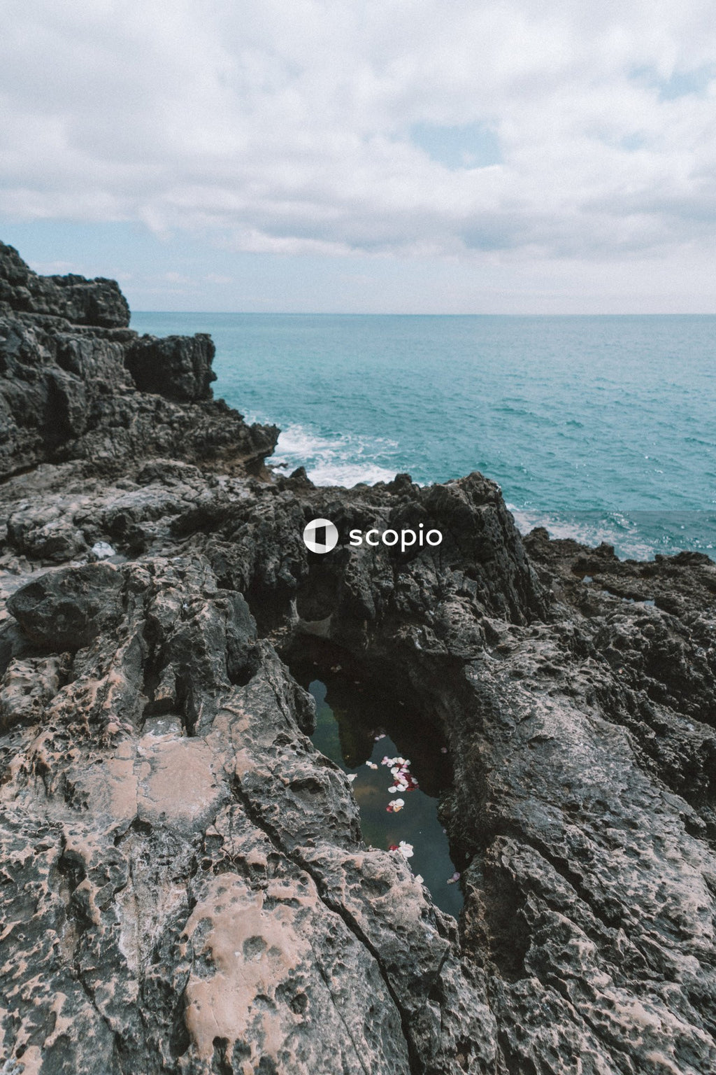 People on rocky shore