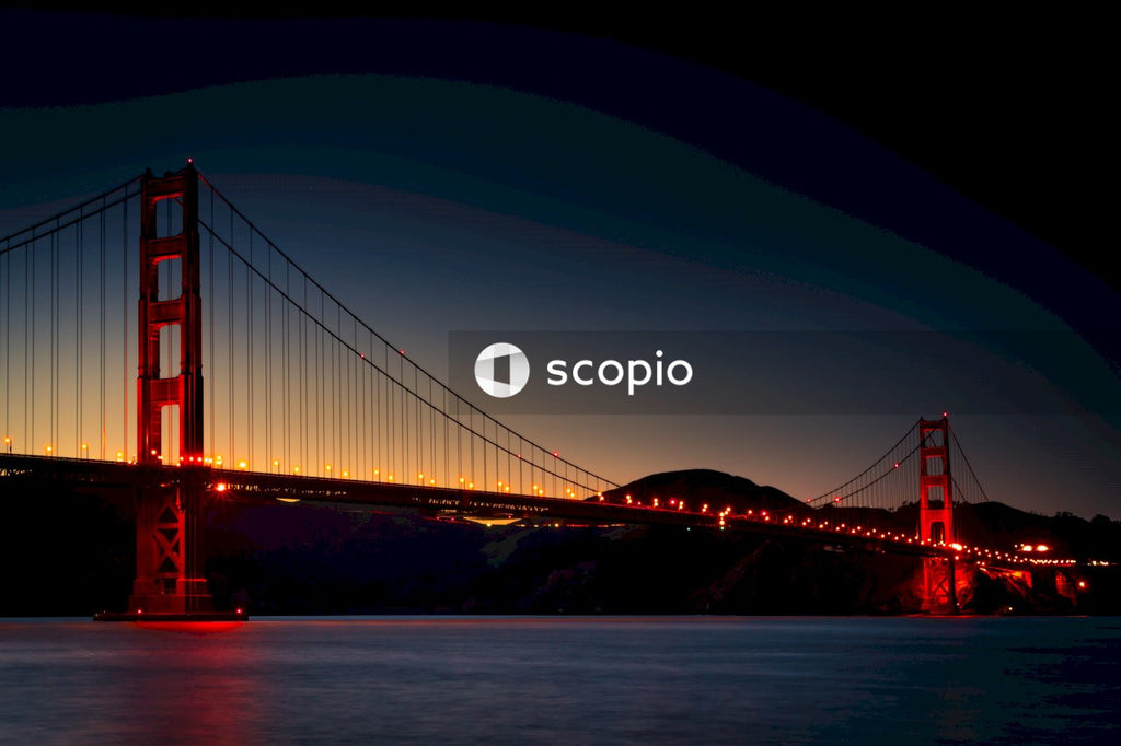 Night View of Golden Gate Bridge With Red Lights and Water Reflections