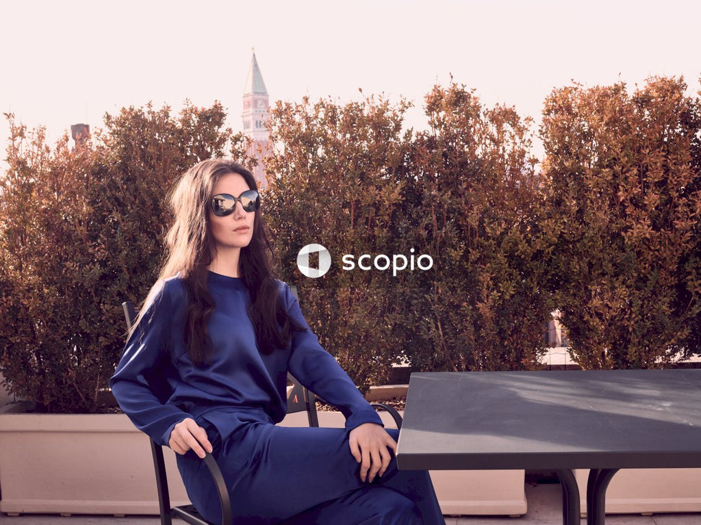 Woman in navy outfit sitting on chair