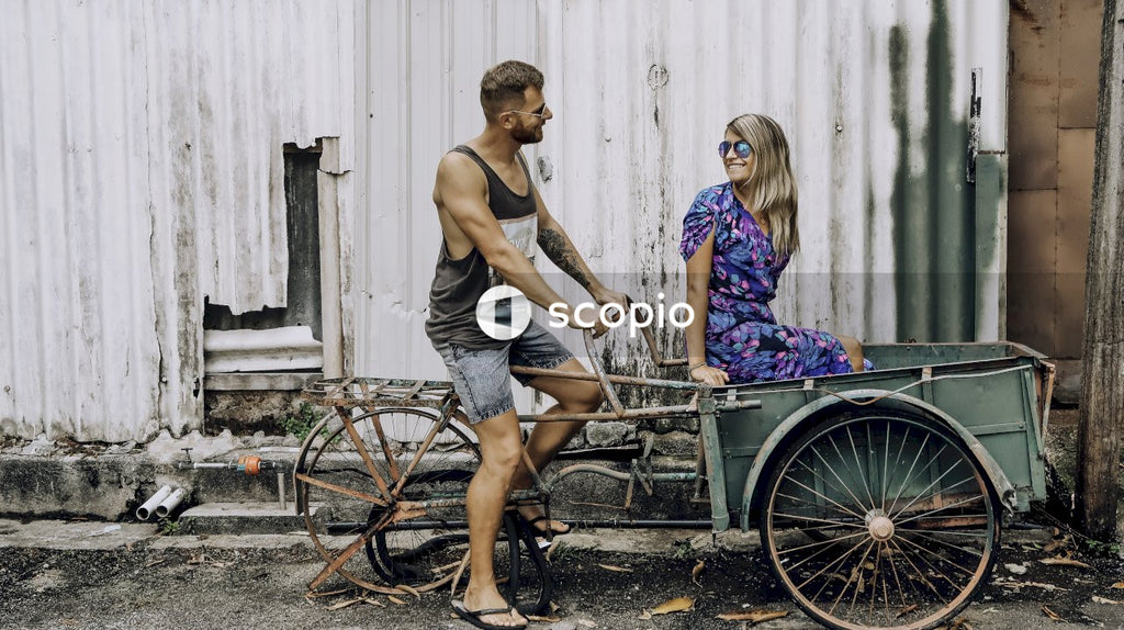 Man riding a rickshaw with a woman