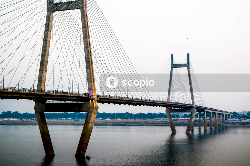 Bridge over water during foggy weather