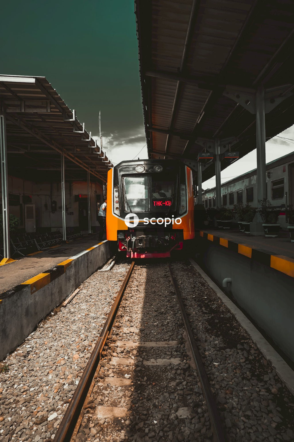 Orange train on rail