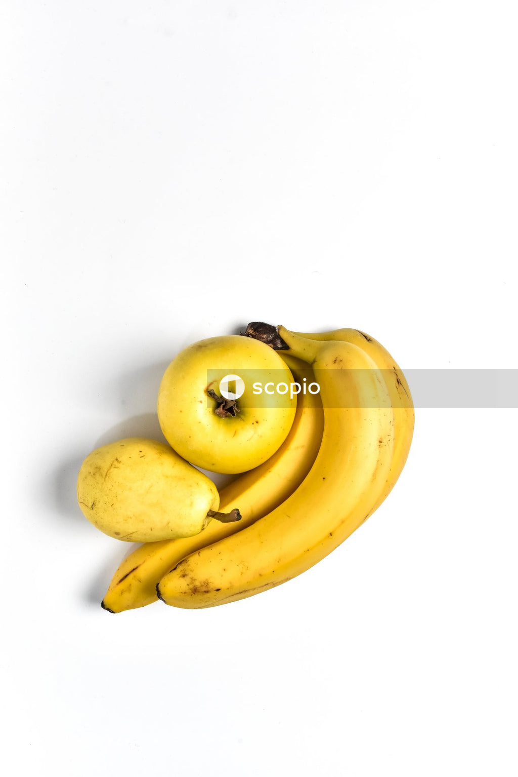 Yellow banana fruit on white surface