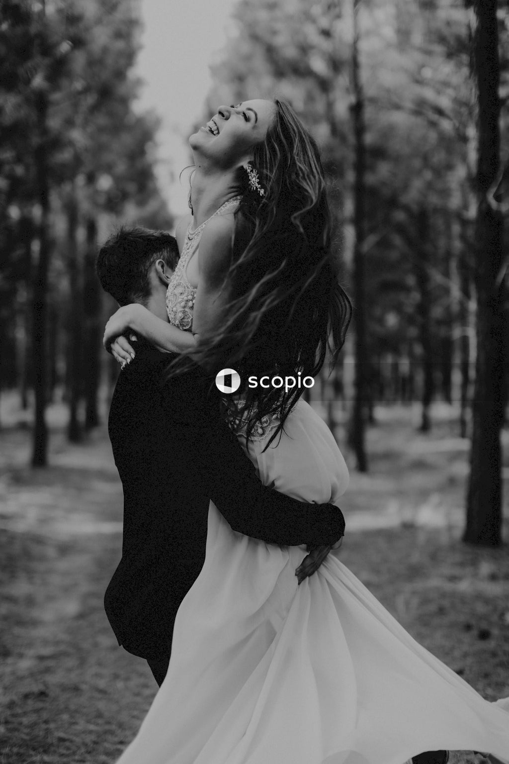 Grayscale photo of couple kissing