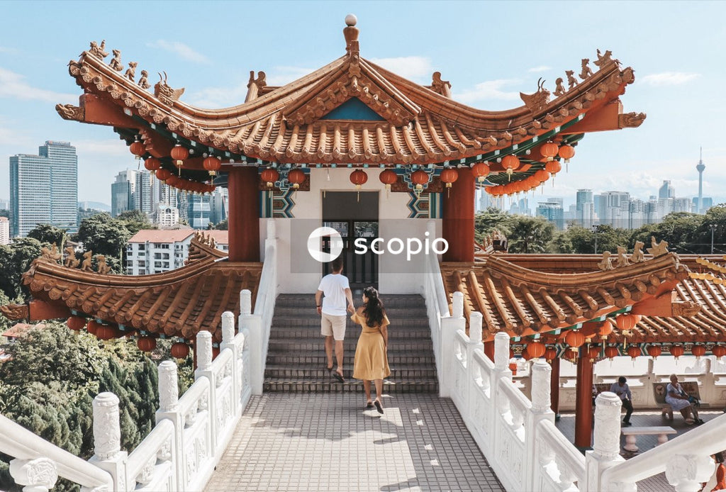 Woman and man standing outside Thean Hou temple
