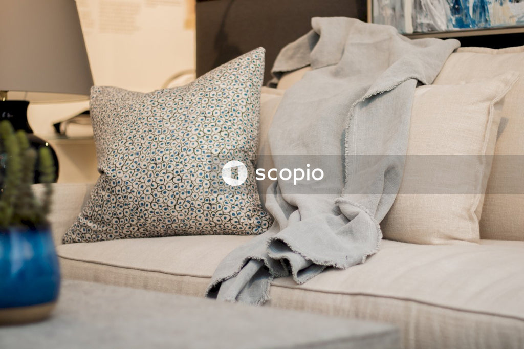 Gray and black throw pillows on white couch