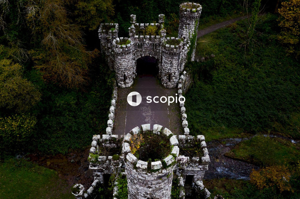 Aerial drone view of Ireland's Ballysaggartmore Towers . Medieval bridge in the forest, Lismore, County Waterford.