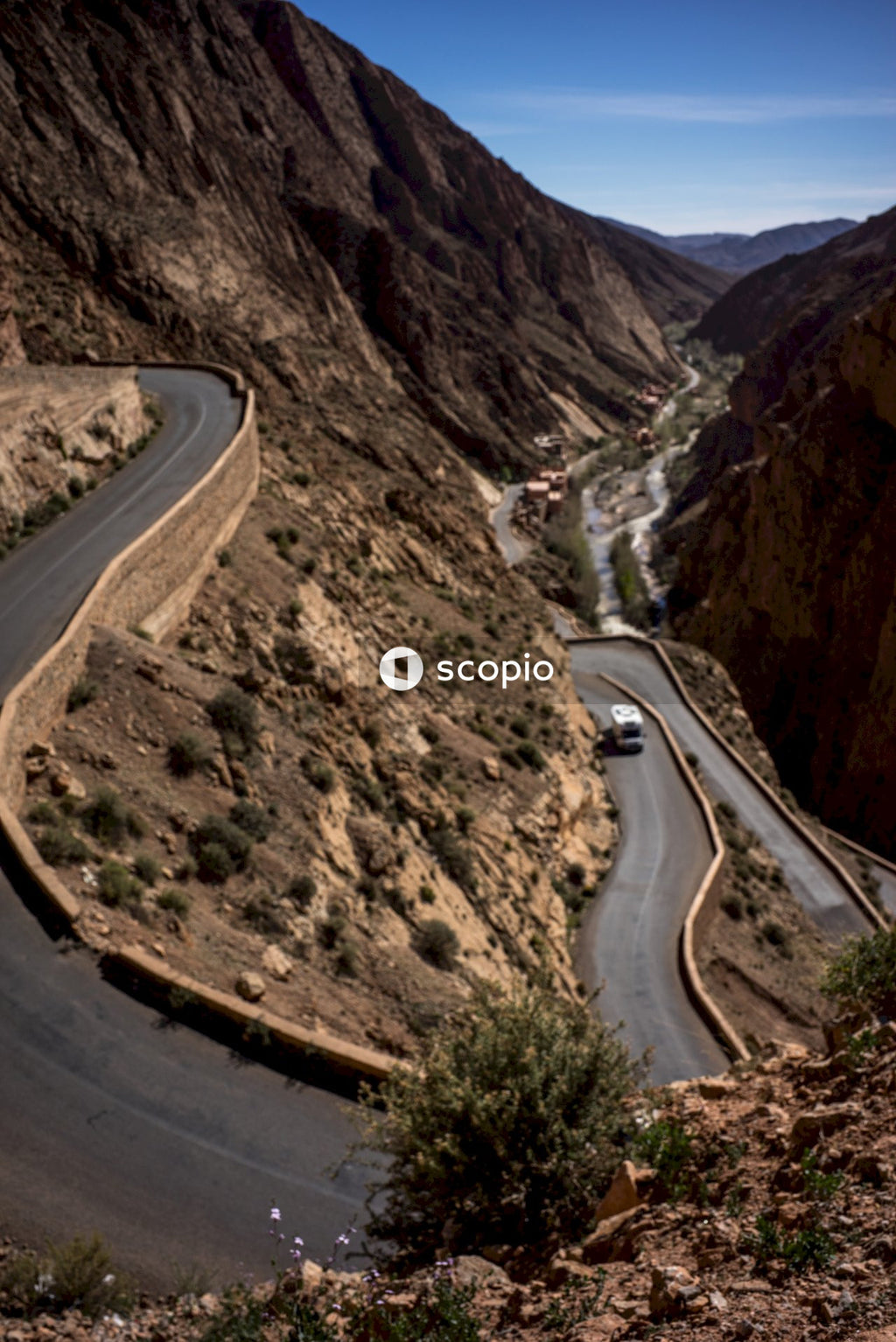 Aerial view of road between mountains