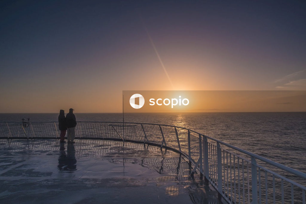 Couple standing near the ocean