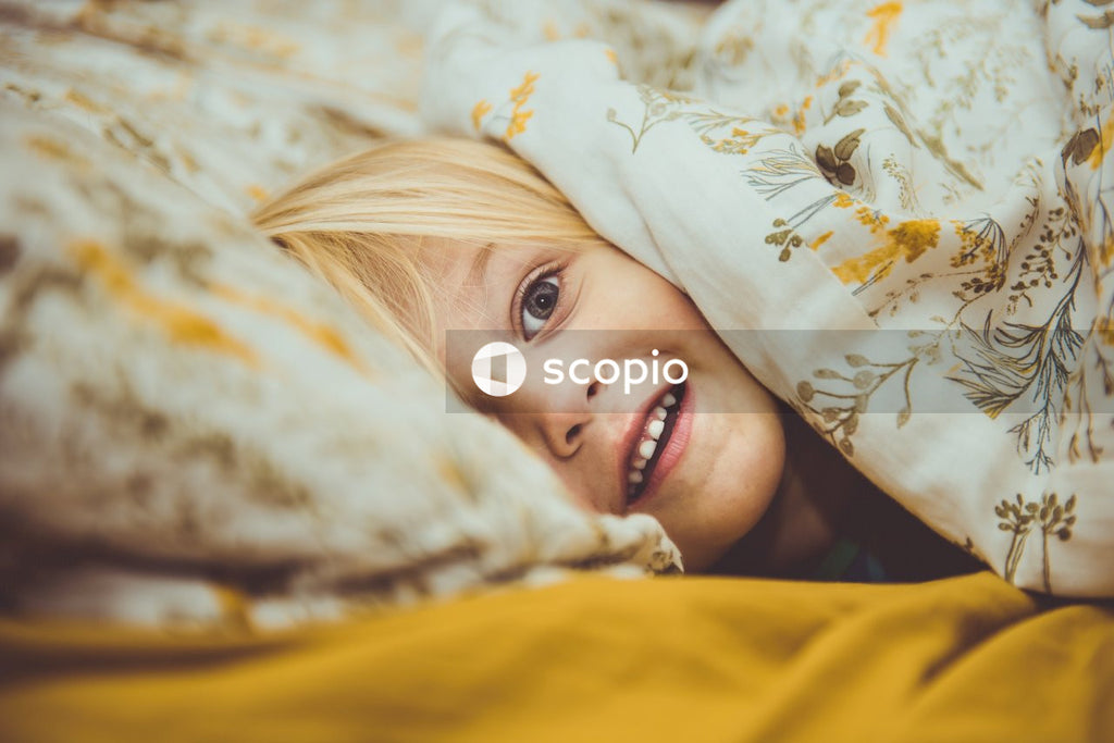 Smiling woman lying on bed